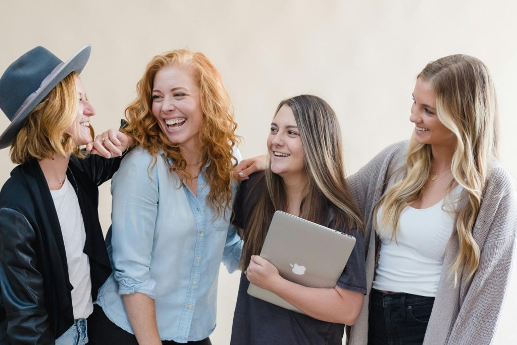 Group of 4 happy girls posing for a pic